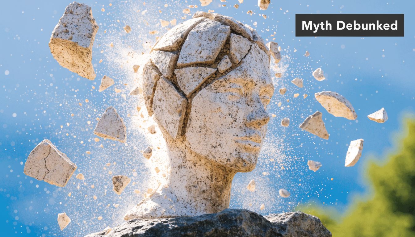 A stone statue head shattering into pieces, representing the concept of debunking common myths or mental limitations.