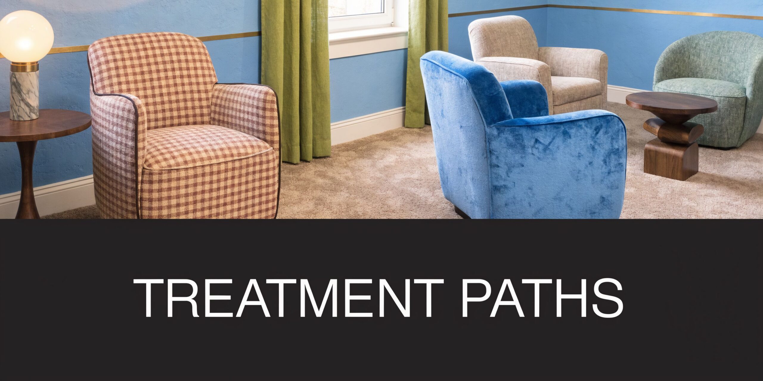 A comfortable lounge area with four distinct armchairs and side tables in a professional therapy office setting.